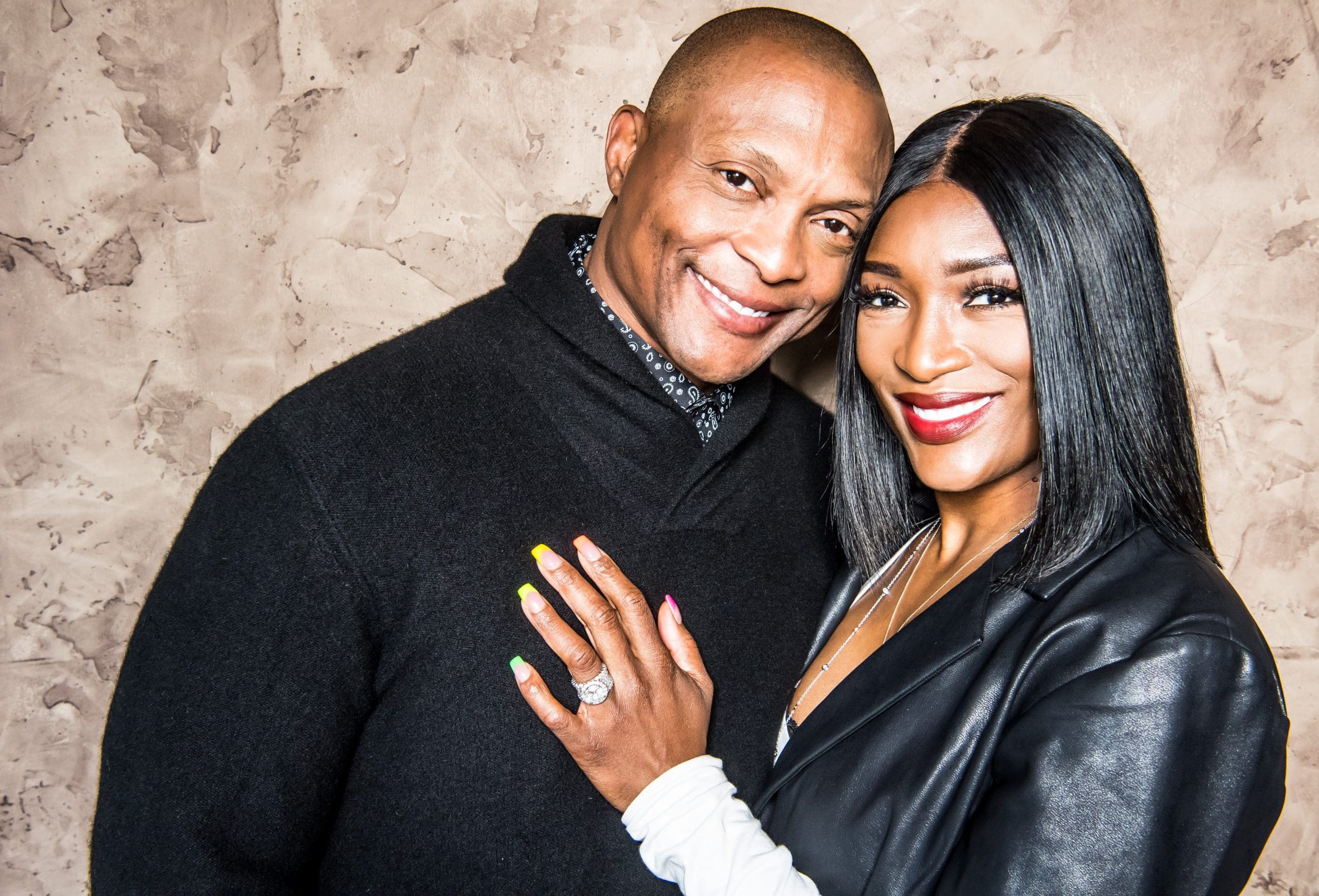 Tamara Johnson George and Edward Nathan George in a black dress.
